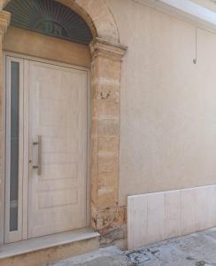 a door on the side of a building at Domus San Francesco in Castelvetrano Selinunte
