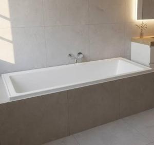 a large white bath tub in a bathroom at Destiny home in Curitiba