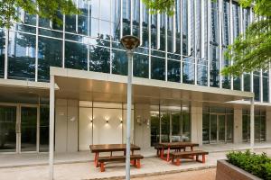 a building with two benches in front of it at Urbanview Hotel Get Inn Pollux Batam in Batam Center +16 photos
