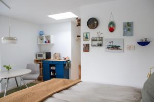 a bedroom with a bed and a small table and a table at B&B Le Maitre in Renkum