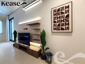 a living room with a tv on a wall at Kease Hittin S-18 Latest Development ZA44 in Riyadh