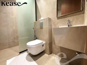 a bathroom with a toilet and a sink at Kease Hittin S-18 Latest Development ZA44 in Riyadh +6 photos