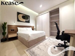 a bedroom with a bed and a desk and a computer at Kease Hittin S-18 Latest Development ZA44 in Riyadh