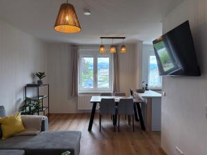 a living room with a table and a dining room at Tom s Apartment II in Knittelfeld