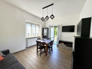 a living room with a table and a couch at Casa dolce Casa in Rapallo