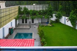 an overhead view of a backyard with a swimming pool at Kudrat Villa with Private Pool in Dehradun