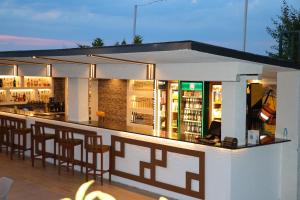 a bar with bar stools at a restaurant at Grand Koru Hotel Beach in Yalova