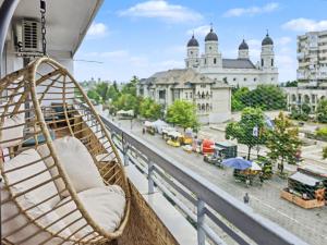 a hammock on a balcony with a view of a city at Konstanzer Stefan 15 - Old Town Apt - Palas Mall - AC in Iaşi