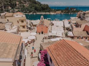 an aerial view of a town with buildings and the water at Luminis Residence by All about Paxos in Gaios +10 photos