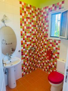 a bathroom with a sink and a toilet at MELIA Holidays & Living in Epanomi +27 photos