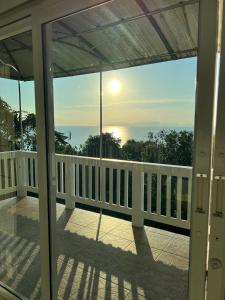 a view from the front porch of a house at The Sunset Suite Panoramic Sea Views in Sikao