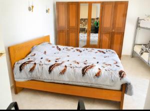 a bedroom with a bed with a bedspread with birds on it at Wonderful Sea View in Borsh