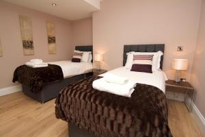Postel nebo postele na pokoji v ubytování Harrogate Lifestyle Luxury Serviced ApartHotel