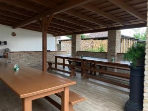 a row of wooden tables on a patio at U svaté Rozálie in Horní Věstonice
