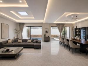 a living room with a couch and a dining room at 52stone scent poolvilla - A in Angeles