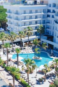 an aerial view of a resort with palm trees and a building at Klajdi Resort & SPA in Golem