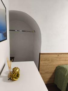 a room with a white table and a chair at Il Caminetto in Montecastrilli