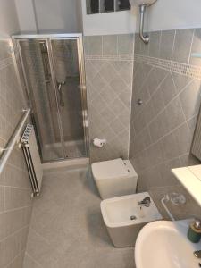 a bathroom with a shower and a toilet and a sink at Il Caminetto in Montecastrilli +11 photos
