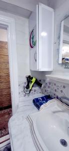 a bathroom with a sink and a cabinet above it at Classic Seaview in Alexandria +19 photos