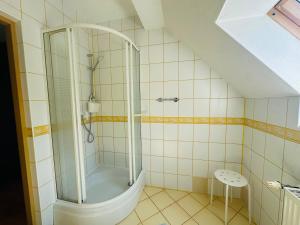 a bathroom with a shower and a toilet at Dom w Niechorzu dla 8 osób z dużym ogrodem - 5D Apartments in Niechorze +27 photos