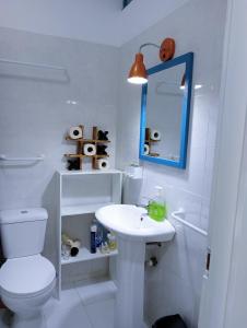 a white bathroom with a toilet and a sink at AMA Apartament Ponta Preta in Calheta Do Maio +163 photos