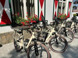 a group of bikes parked in front of a building at La Maison de Rose in Riemst