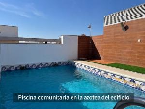 a swimming pool on the side of a building at Casa Yaye Ecija in Écija