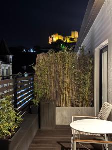 a balcony with a table and chairs on a building at Leiria Design Suites in Leiria +24 photos