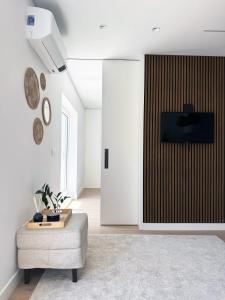 a living room with a couch and a table at Leiria Design Suites in Leiria