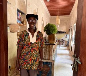 a man is standing in a hallway at Subira House in Lamu