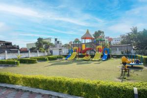 a playground with a play equipment in a park at ROYAL GITANJALI RESORTS & SPA in Mandarmoni