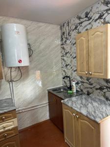 a kitchen with a sink and a counter top at Tsovazard Life Lake in Tsovazard +6 photos