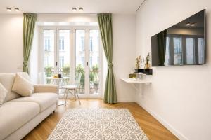 a living room with a couch and a table at B and G San Babila- Luxury in the heart of Milano - Design district in Milan