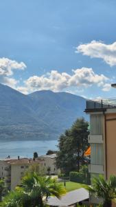 a building with a view of a body of water at Wohnung nr 103 in Muralto
