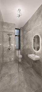 a bathroom with a sink and a toilet and a mirror at White House Meerane - Loft Sky in Meerane +6 photos