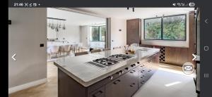 a kitchen with a stove top oven in a room at Villa Hortensia in Meise