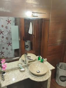 a bathroom with a sink and a mirror at STADIUM 2 Apartments Sandanski in Sandanski