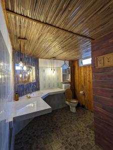 a bathroom with a sink and a toilet at Bon Vivant Front de Mer - Ile Rodrigues in Rodrigues Island +221 photos
