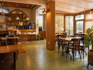 a restaurant with tables and chairs in a room at Margosa Boutique Hotel Tel-Aviv Jaffa in Tel Aviv +100 photos