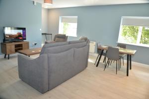 a living room with a couch and a table at Darnley Lodge Hotel in Athboy