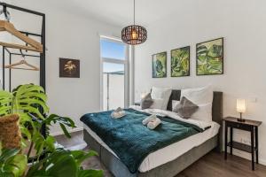 a bedroom with a bed with two stuffed animals on it at Cozy Apartment Central Kitchen Balcony in Frechen