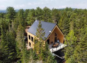 an overhead view of a house in the woods at Chalet OSLO in Saint Come