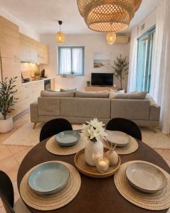 a living room with a couch and a table at Apartment Aleks in Tar
