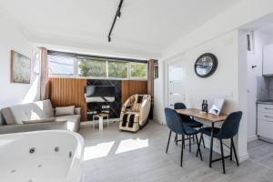 a living room with a couch and a table at Green Luxe Suite 2 by PikHost in Shkodër