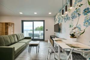 a living room with a couch and a table at Apartamenty w Żywcu u Astrid in Żywiec