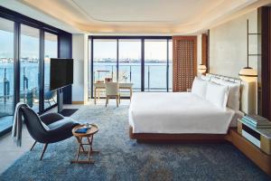 a hotel room with a large bed and a television at InterContinental Yokohama Pier 8 by IHG in Yokohama