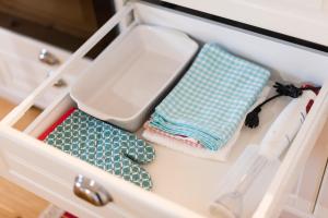 a drawer with two mats and a sink and towels at Casa Do Mercado by Heart of Funchal in Funchal +95 photos