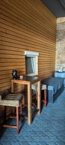 a room with a table and a bench and a television at Haus Schneider in Kappel-Grafenhausen