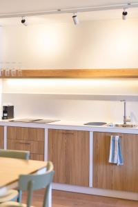 a kitchen with a sink and a counter at Appart'hotel Saint Francois in Calvi +9 photos
