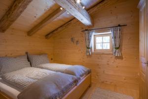 Кровать или кровати в номере Chalet Ursteinhütte